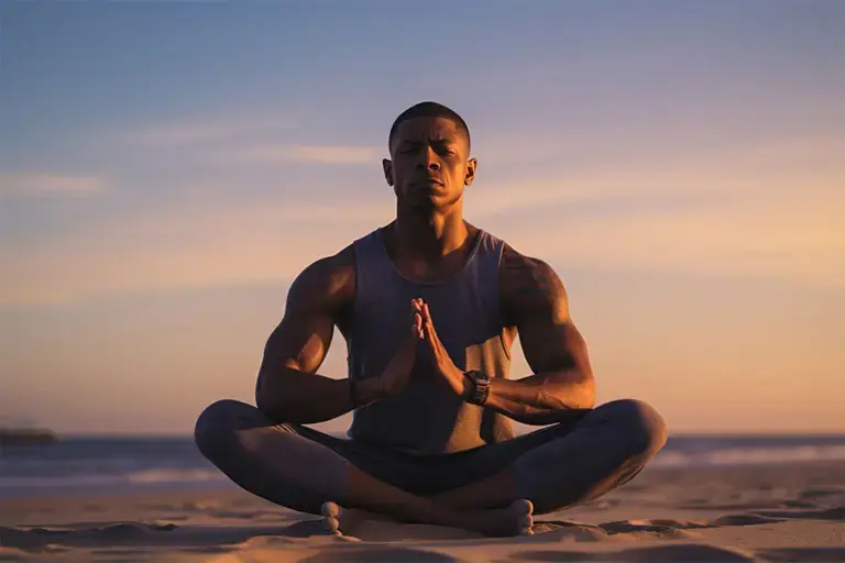 addiction-holistic-recovery-nevada Man doing yoga at the beach